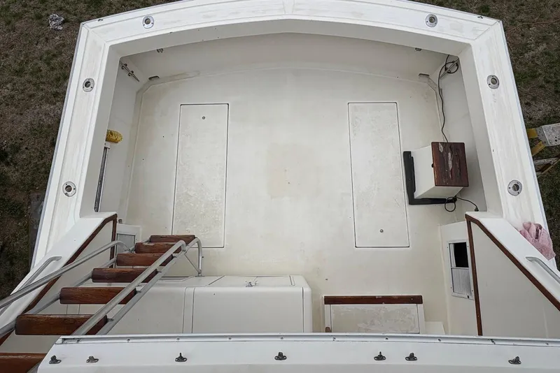 Slide: The Image of 1988 Viking 41 Convertible yacht docked at marina, featuring "Hide & Seek" name on stern. - 4