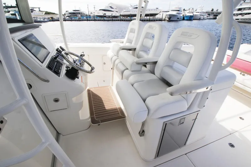 Slide: The Image of Interior of 2012 Boston Whaler 370 Outrage with helm and seating. - 11