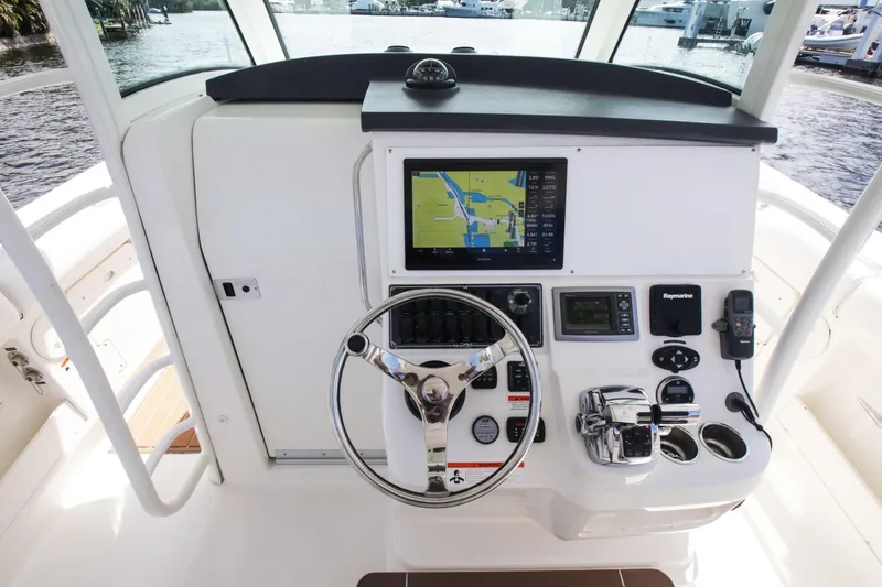 Slide: The Image of 2012 Boston Whaler 370 Outrage helm with navigation system. - 12