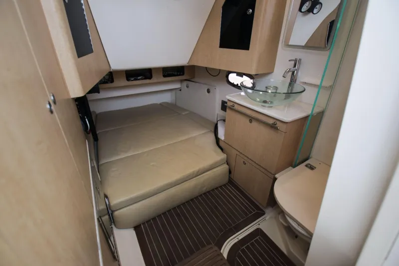 Slide: The Image of Interior of 2012 Boston Whaler 370 Outrage with bed and sink. - 14