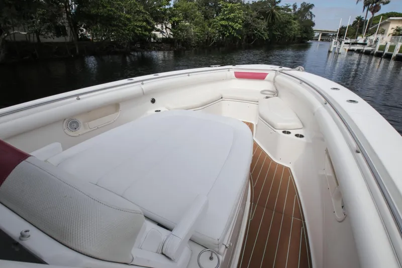 Slide: The Image of 2012 Boston Whaler 370 Outrage boat with spacious deck and seating area. - 15