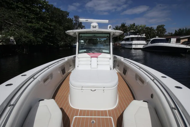Slide: The Image of 2012 Boston Whaler 370 Outrage on calm waters, luxurious deck. - 17