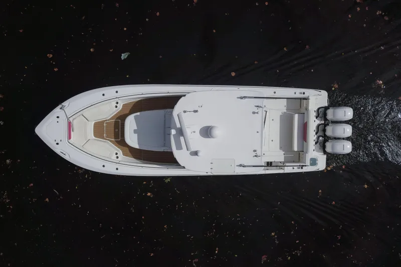 Slide: The Image of Aerial view of 2012 Boston Whaler 370 Outrage boat on dark water. - 2