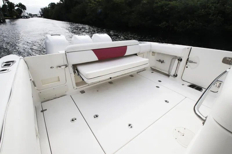 Slide: The Image of 2012 Boston Whaler 370 Outrage with spacious deck and seating area. - 8