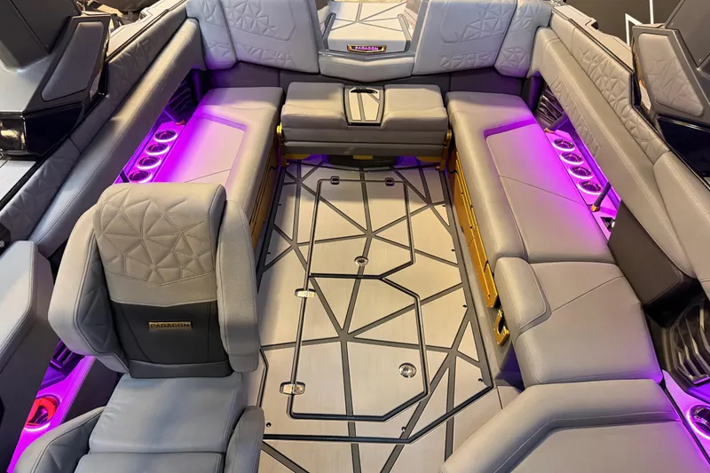 Slide: The Image of Luxurious interior of 2024 Nautique Super Air Nautique G25 Paragon with ambient lighting. - 12