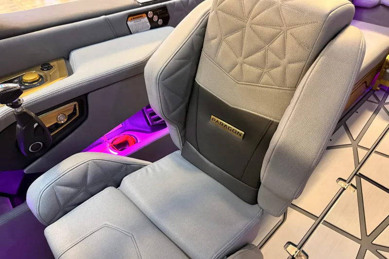 Slide: The Image of 2024 Nautique Super Air Nautique G25 Paragon luxury boat seat with illuminated cup holders. - 13