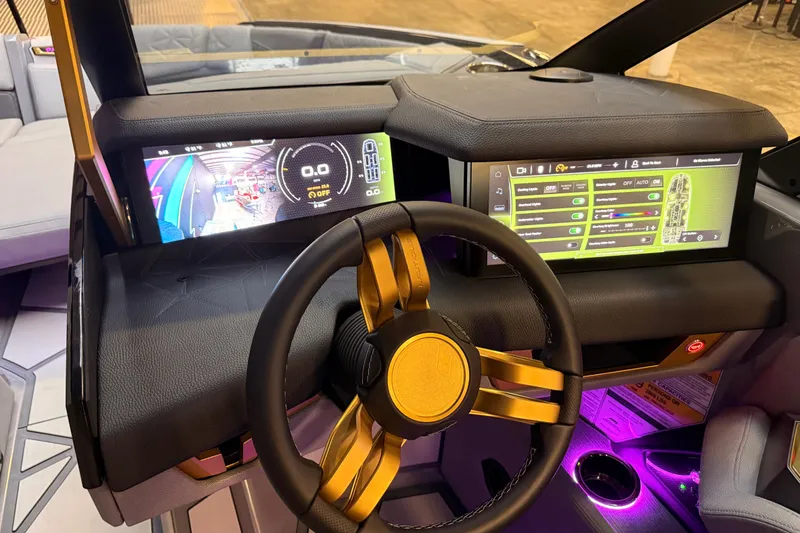 Slide: The Image of 2024 Nautique Super Air Nautique G25 Paragon dashboard with advanced digital displays and controls. - 14
