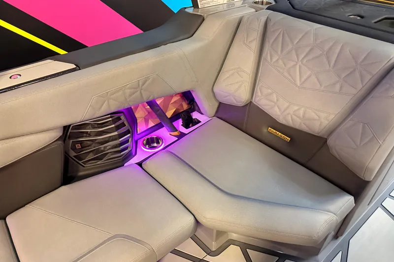 Slide: The Image of 2024 Nautique Super Air Nautique G25 Paragon interior with stylish seating and ambient lighting. - 15