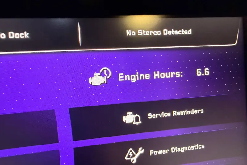 Slide: The Image of Dashboard display of 2024 Nautique Super Air Nautique G25 Paragon showing 6.6 engine hours. - 20