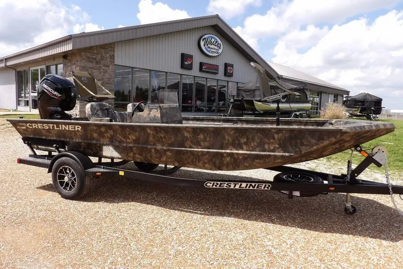The Image of 2026 Crestliner 1860 Retriever SC boat on trailer outside dealership. - 1