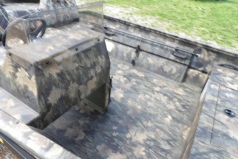 Slide: The Image of 2026 Crestliner 1860 Retriever SC boat with camouflage interior design. - 11