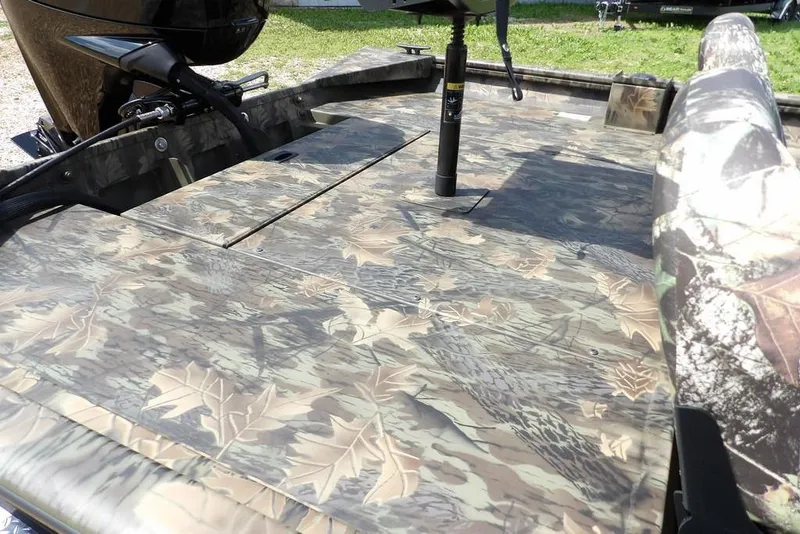 Slide: The Image of 2026 Crestliner 1860 Retriever SC boat with camouflage deck and seating. - 14