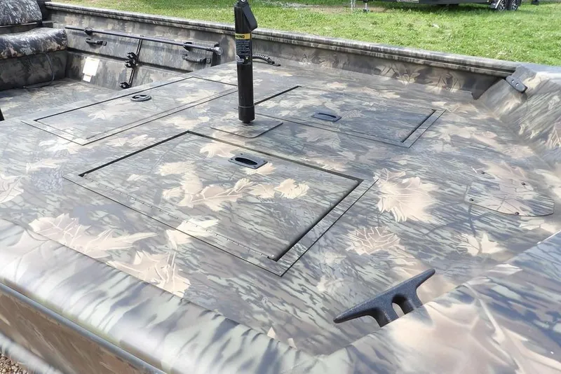 Slide: The Image of 2026 Crestliner 1860 Retriever SC boat with camouflage design and spacious deck. - 15