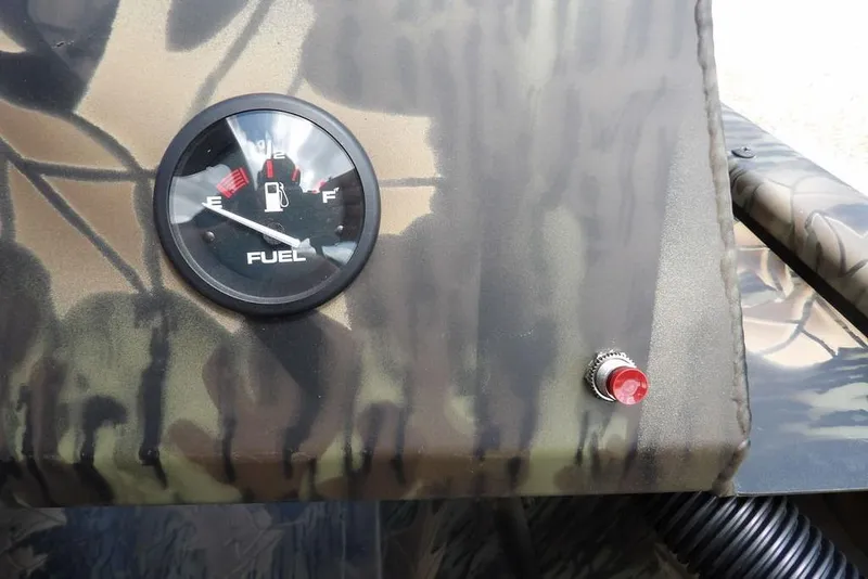 Slide: The Image of Fuel gauge and button on 2026 Crestliner 1860 Retriever SC boat dashboard. - 21
