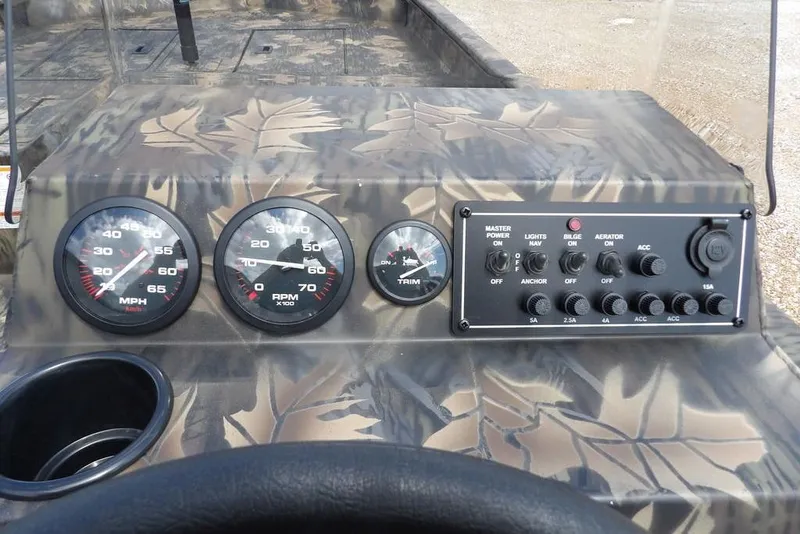 Slide: The Image of Dashboard of 2026 Crestliner 1860 Retriever SC with gauges and control panel. - 22