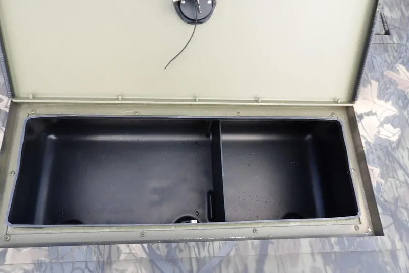 Slide: The Image of Open storage compartment in 2026 Crestliner 1860 Retriever SC boat. - 27