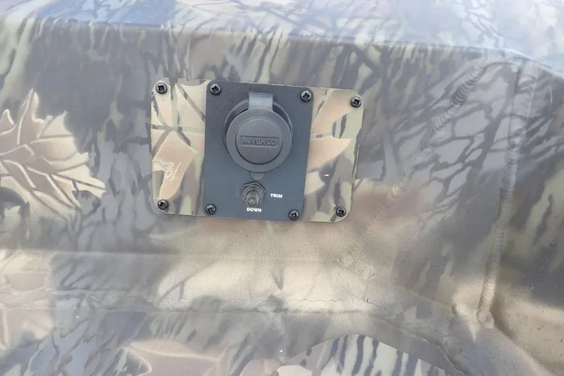 Slide: The Image of 2026 Crestliner 1860 Retriever SC camo trim control panel detail. - 29