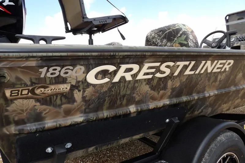 Slide: The Image of 2026 Crestliner 1860 Retriever SC boat with camouflage design and branding. - 36