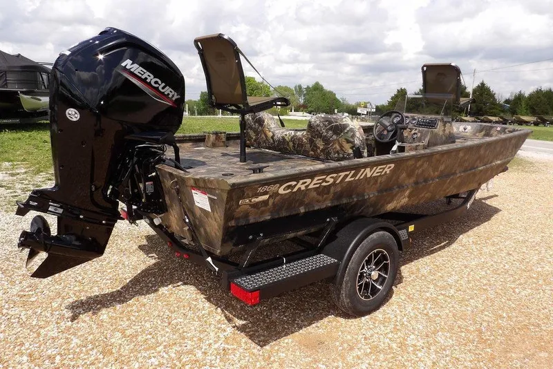 Slide: The Image of 2026 Crestliner 1860 Retriever SC boat with camouflage design and Mercury outboard motor. - 6