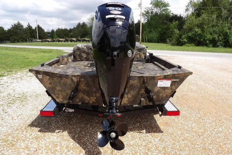 Slide: The Image of 2026 Crestliner 1860 Retriever SC boat with camouflage design and powerful outboard motor. - 9