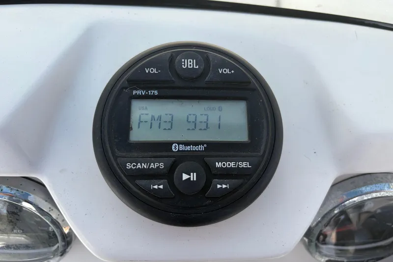 Slide: The Image of JBL PRV-175 radio display on 2021 Zodiac N-ZO 680, tuned to FM 93.1. - 12
