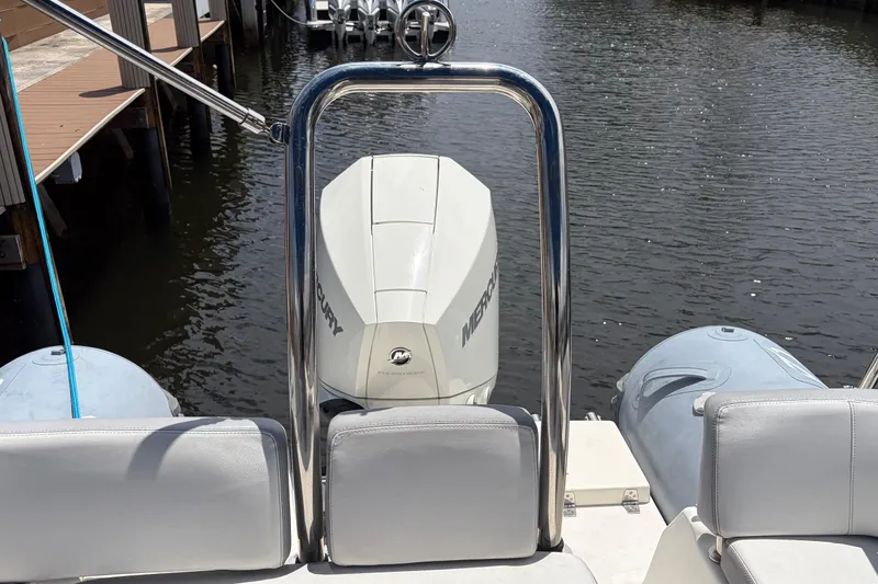 Slide: The Image of 2021 Zodiac N-ZO 680 boat with Mercury engine, docked on calm water. - 19