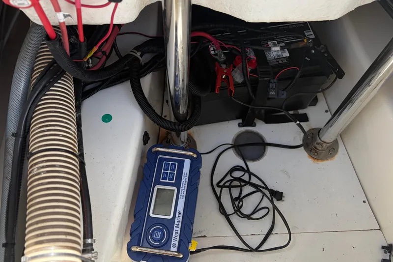 Slide: The Image of Battery compartment of 2021 Zodiac N-ZO 680 with marine equipment and wiring. - 27