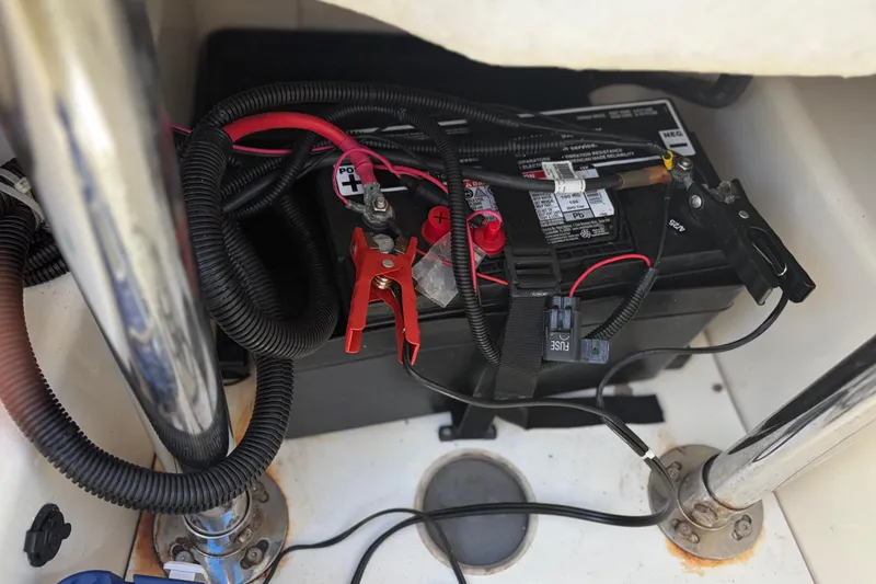 Slide: The Image of Battery compartment of 2021 Zodiac N-ZO 680 boat with cables and connectors. - 28
