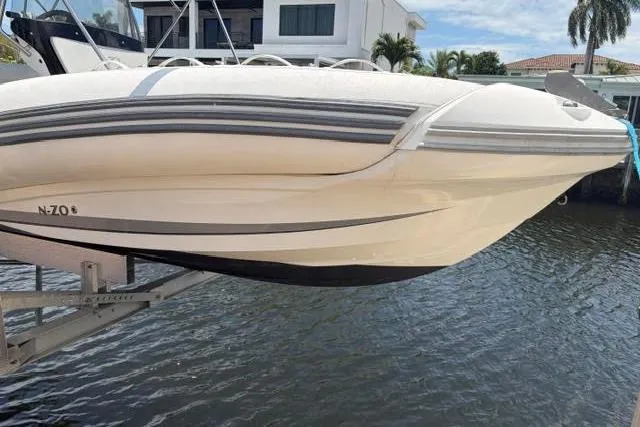 Slide: The Image of 2021 Zodiac N-ZO 680 boat on lift by waterfront property. - 5