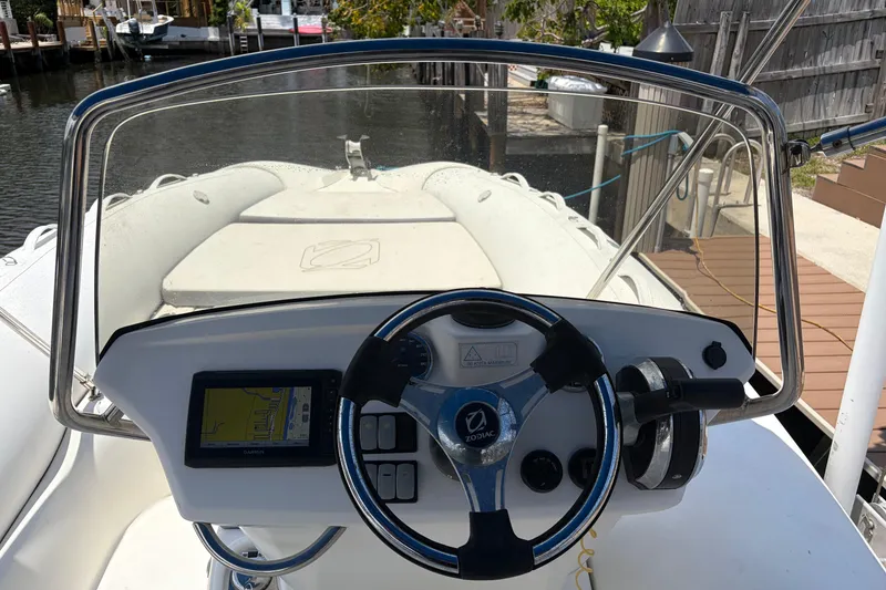 Slide: The Image of 2021 Zodiac N-ZO 680 boat dashboard with steering wheel and navigation system. - 8