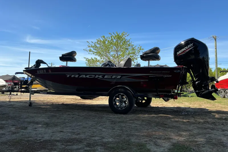 Slide: The Image of 2020 Tracker Pro Team 175 TXW Tournament Edition boat on trailer, outdoors. - 4