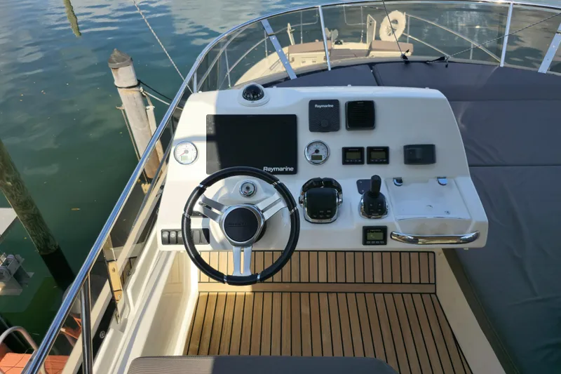 Slide: The Image of Steering console of a 2018 Prestige 460 yacht with modern navigation equipment. - 15