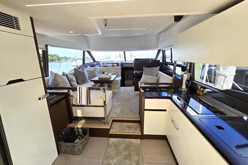 Slide: The Image of Luxurious interior of a 2018 Prestige 460 yacht with modern kitchen and seating area. - 18