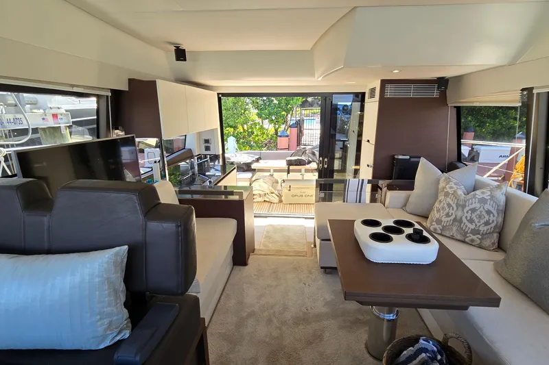 Slide: The Image of Luxurious interior of a 2018 Prestige 460 yacht with elegant seating and modern decor. - 19