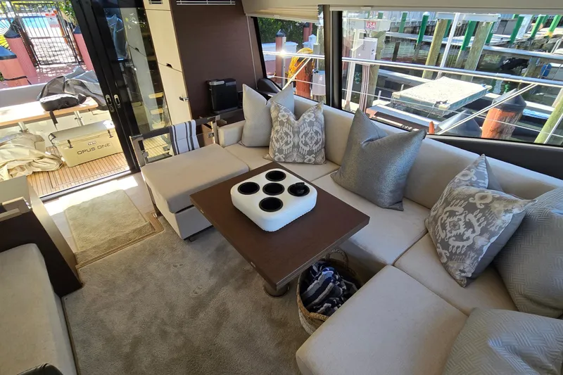 Slide: The Image of Luxurious interior of a 2018 Prestige 460 yacht with elegant seating and decor. - 24