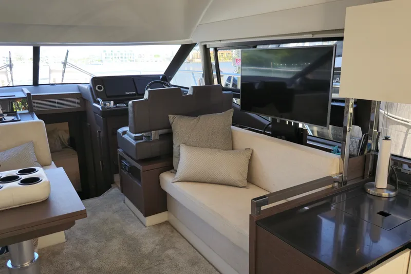 Slide: The Image of Luxurious interior of a 2018 Prestige 460 yacht featuring plush seating and modern amenities. - 25