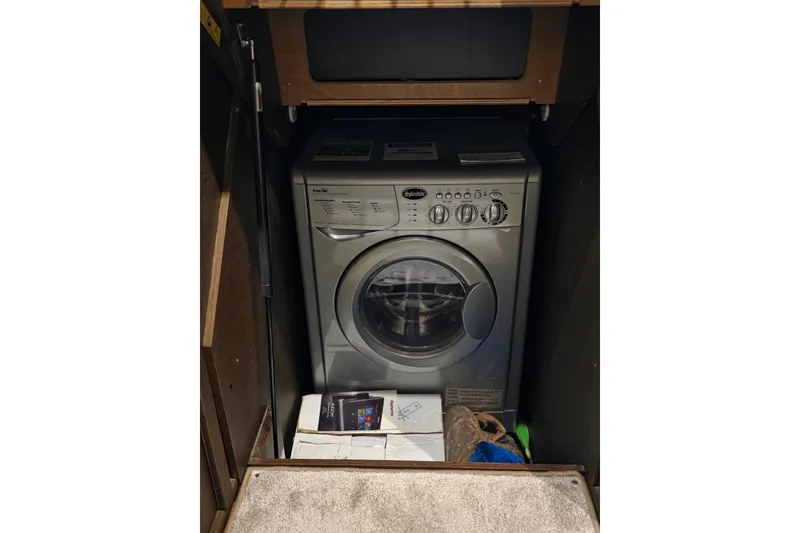 Slide: The Image of Compact washing machine in a wooden cabinet on a Prestige 460 yacht, 2018 model. - 29