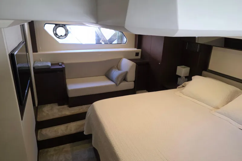 Slide: The Image of Luxurious cabin interior of 2018 Prestige 460 yacht with bed and seating area. - 39