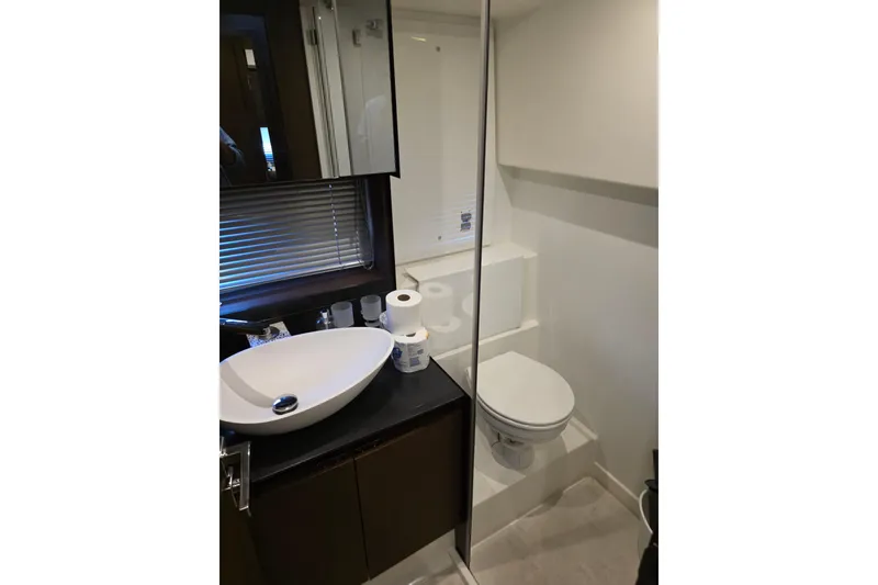 Slide: The Image of Modern bathroom in 2018 Prestige 460 yacht with sleek sink and toilet. - 42
