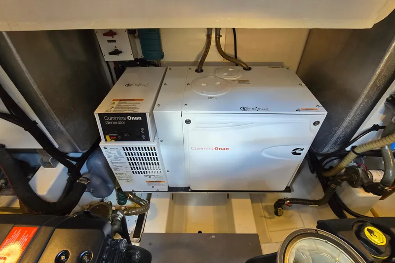 Slide: The Image of Cummins Onan generator in 2018 Prestige 460 yacht engine room, showcasing advanced marine technology. - 44