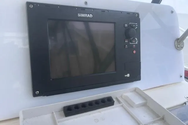 Slide: The Image of Simrad marine display on 1999 Grady-White Marlin 300 boat dashboard. - 14