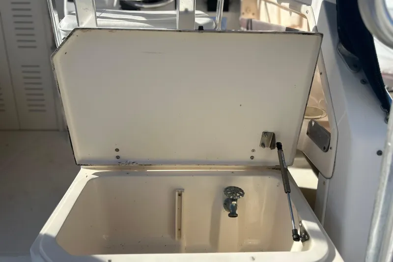 Slide: The Image of Open storage compartment on a 1999 Grady-White Marlin 300 boat. - 15