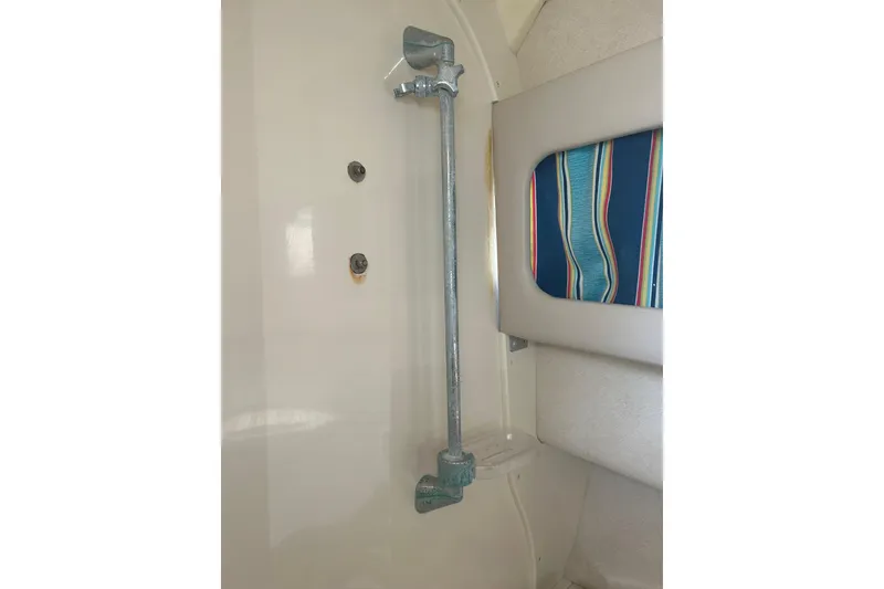 Slide: The Image of Interior detail of a 1999 Grady-White Marlin 300 boat, featuring a metal support bar. - 23