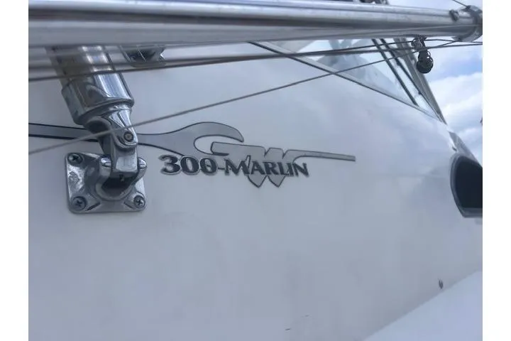 Slide: The Image of 1999 Grady-White Marlin 300 boat logo and railing detail. - 9