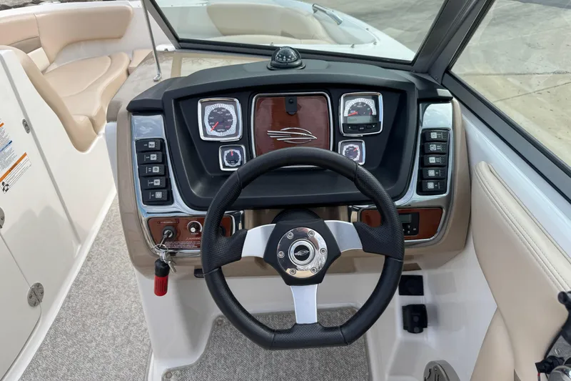 Slide: The Image of Steering console of 2012 Chaparral 224 Sunesta boat with gauges and controls. - 10