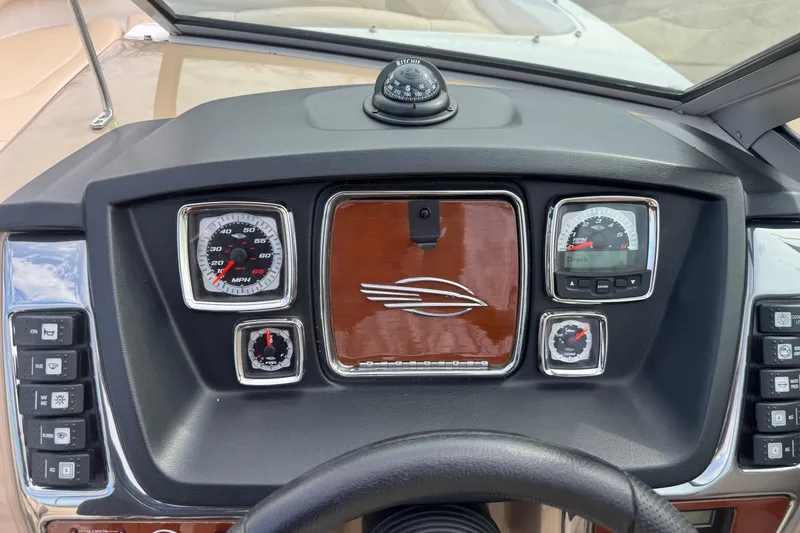Slide: The Image of Dashboard of a 2012 Chaparral 224 Sunesta boat with gauges and controls. - 11