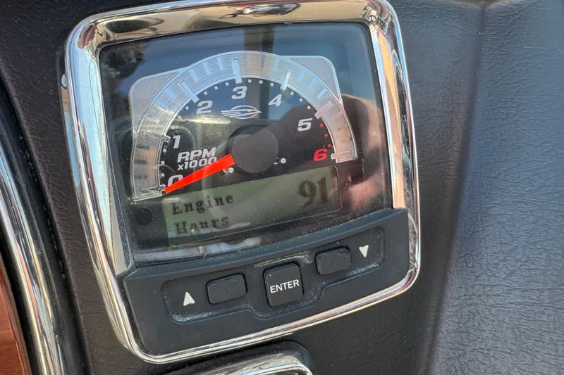 Slide: The Image of Close-up of 2012 Chaparral 224 Sunesta tachometer showing 91 engine hours. - 12