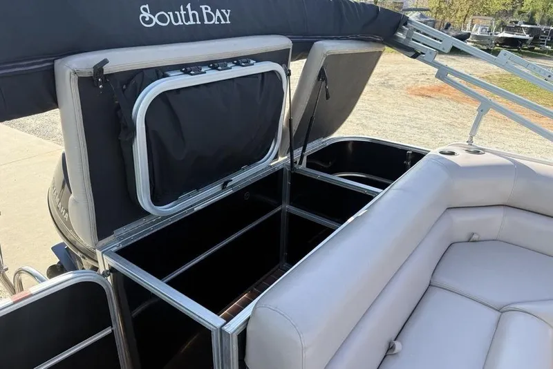 Slide: The Image of 2013 South Bay 422 CR boat interior with plush gray seating. - 12
