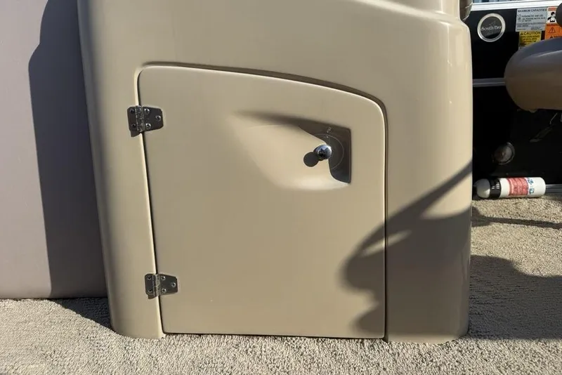 Slide: The Image of Open storage compartment on a 2013 South Bay 422 CR boat, revealing interior wiring. - 15