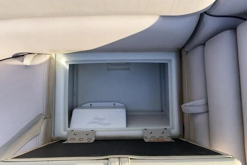 Slide: The Image of 2013 South Bay 422 CR boat interior with plush seating and steering console. - 18